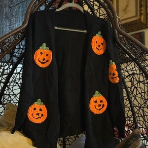 BloomChic Black Knit Cardigan with Orange Pumpkin Design